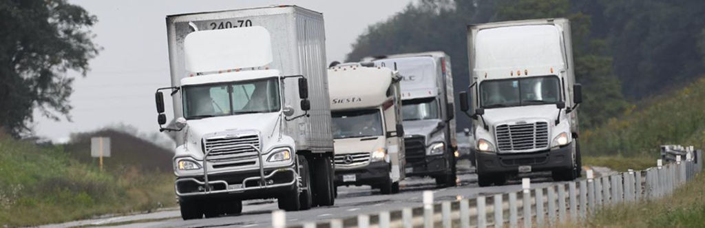 Precision Machining Tritenco Heavy-Duty Transmission Parts Manufacturer - Fleet of Trucks on Highway